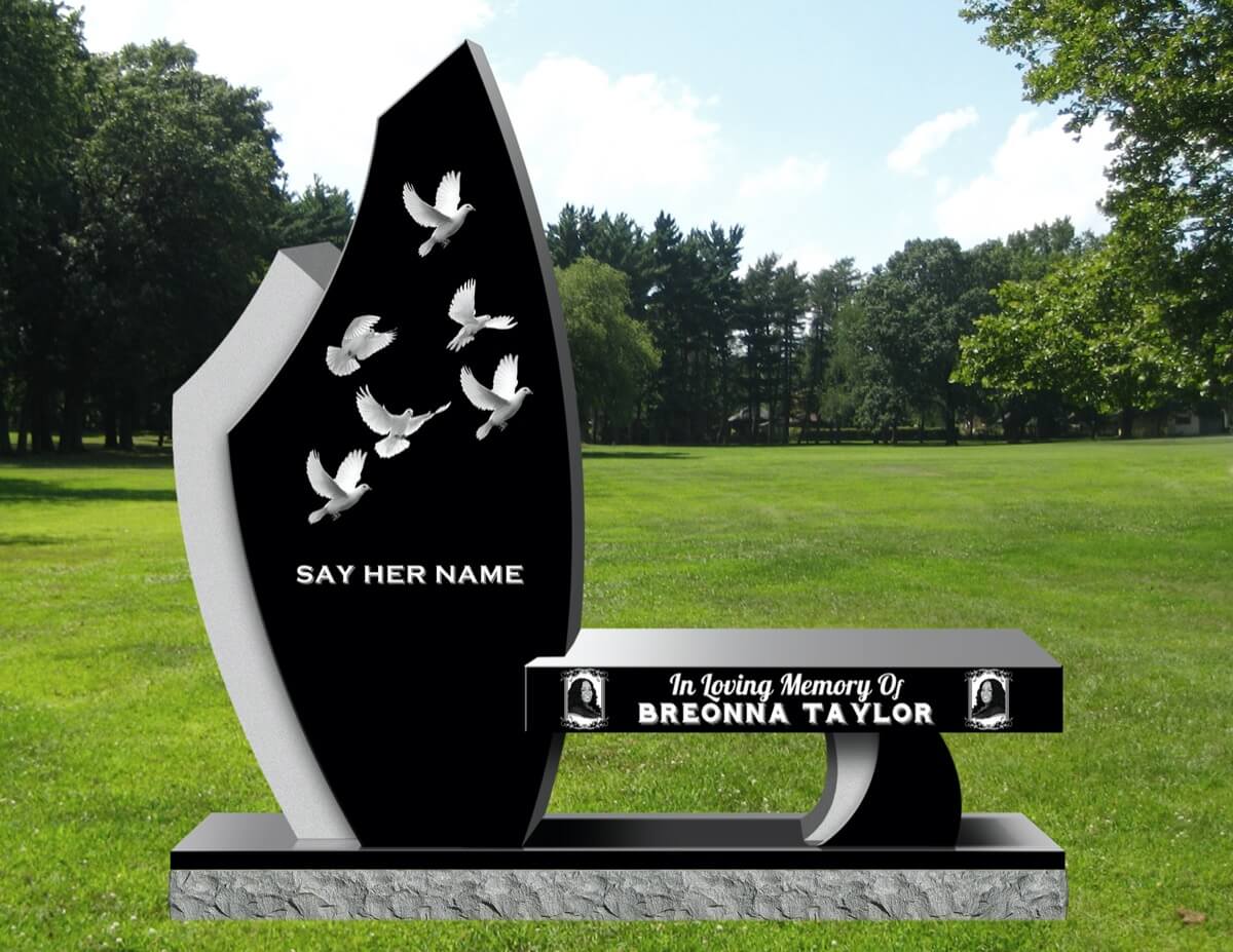 Black granite memorial and bench with carved doves and the words Say Her Name, in memory of Breonna Taylor