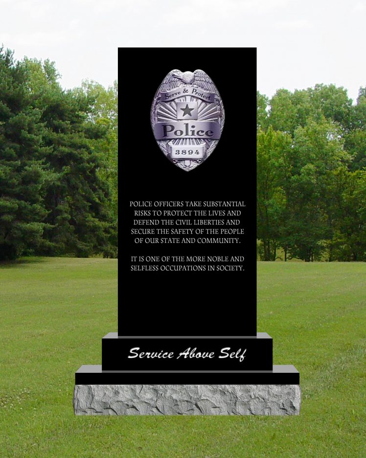 Black granite civic memorial with a police badge and the words Service Above Self